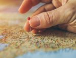 Map with hand putting pin in illustrates growth of ABA Centers of America