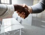 Embark Behavioral Health hires new executives illustrated by a handshake