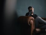 out-of-pocket costs for behavioral health and other data in a story illustrated by photo of man holding head